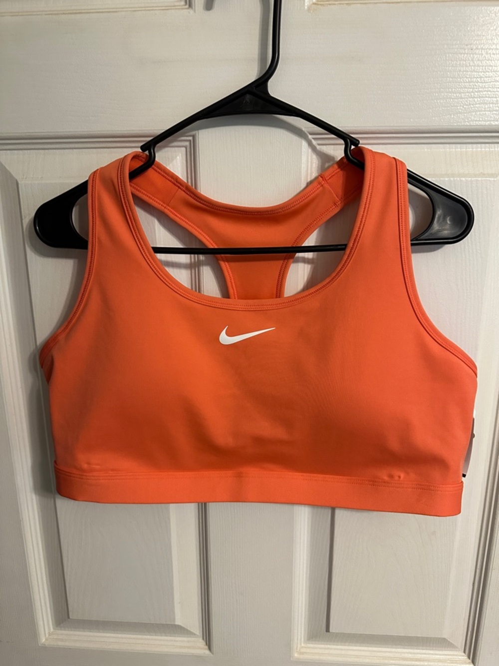 Nike Women's Orange Racerback Sports Bra with White Swoosh
